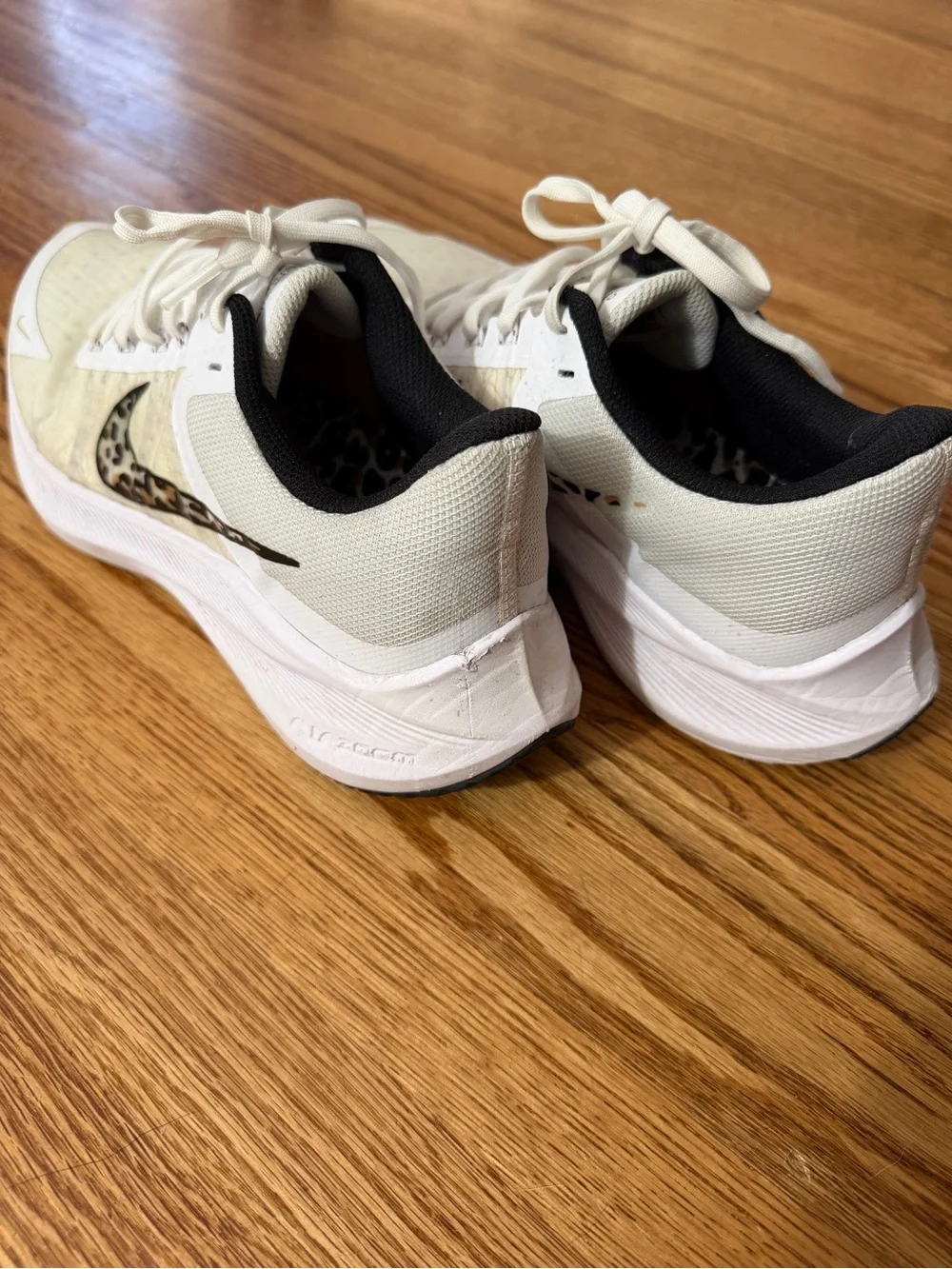 Nike Women’s White Athletic Sneakers with Leopard-Print Swoosh